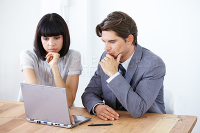 Buy stock photo Business people, laptop and thinking in meeting for strategy, planning or brainstorming decision at the office. Thoughtful businessman or woman wondering in team project plan on computer at workplace