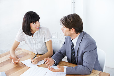 Buy stock photo Business people, documents and writing in meeting for strategy, planning or brainstorming on office desk. Businessman and woman in team collaboration with paperwork for project plan at the workplace