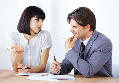 Buy stock photo Business people in discussion about paperwork in meeting, team in conference room and collaboration. Data analysis, employees coworking with man and woman in office, teamwork and review documents
