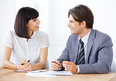 Buy stock photo Happy business people, documents and collaboration in finance, partnership or team strategy on office desk. Businessman and woman smiling for teamwork, financial paperwork or spreadsheet at workplace