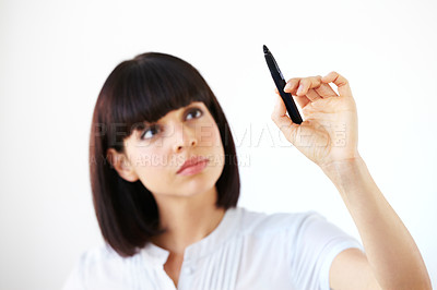 Buy stock photo Business woman, writing and thinking for schedule, planning or strategy against a white studio background. Serious female employee in brainstorming, project plan or tasks for ideas or reminder