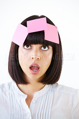 Buy stock photo Confused, planning and woman brainstorming in studio with a shock, surprise or thinking face expression. Idea, contemplating and female model with paper notes on her head isolated by white background