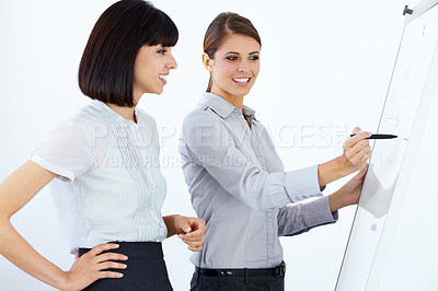 Buy stock photo Business people, writing and coaching in meeting on whiteboard for planning, strategy or collaboration at office. Employee women in planning, schedule or training staff in presentation at workplace