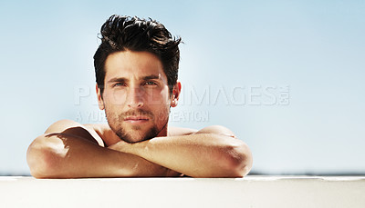 Buy stock photo Portrait of a good-looking male staring at you relaxing on a summer's day - Copyspace