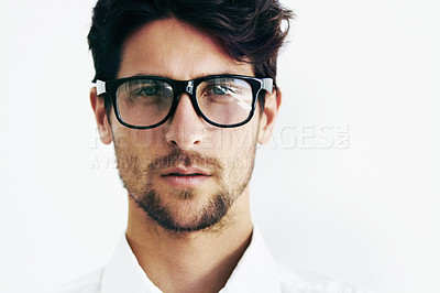 Buy stock photo Cropped portrait of a handsome male sporting black rimmed glasses next to copyspace