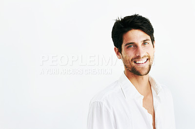 Buy stock photo Happy young man, portrait smile and mockup with shirt for fashion or style against a studio background. Face of attractive or handsome male person or casual model posing with positive mindset