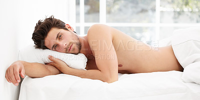 Buy stock photo Handsome portrait, man in bed and morning wake up time with sensual pose, relax and rest in apartment. Sleep, relaxing and sexy, tired topless male model with muscle waking in bright bedroom of home.