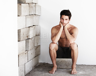 Buy stock photo Thinking, sexy man with serious look and wall background with beauty, glow and confidence. Attractive, confident and sensual face of male model on brick backdrop in morning with thoughtful expression