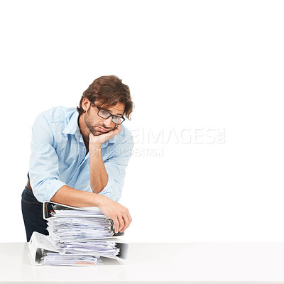 Buy stock photo Stress, burnout and businessman with paper, documents and workload pressure on a white background. Overwhelmed, male and corporate employee with boring admin task looking exhausted, sad and isolated