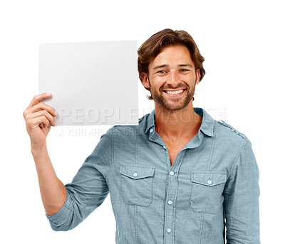 Buy stock photo Portrait, man and poster in studio for mockup, marketing or advertising space isolated on white background. Face, banner and happy male holding blank paper for logo, branding or advertisement mock up