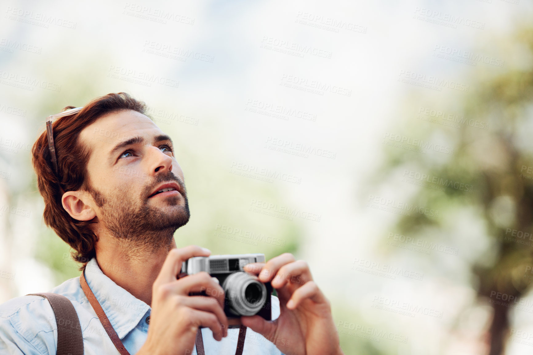 Buy stock photo Photographer, camera or man on holiday, vacation or trip for a fun summer adventure in Italy looking up. Bokeh mockup space, tourist or person with sightseeing in nature journey or park for travel