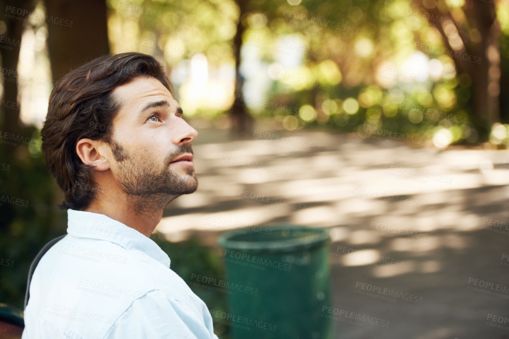 Buy stock photo Thinking, summer and a man in nature for a break, relax and vacation in the morning. Young, calm and a person with an idea, sightseeing or sitting to enjoy a garden, park or outdoor view as a tourist