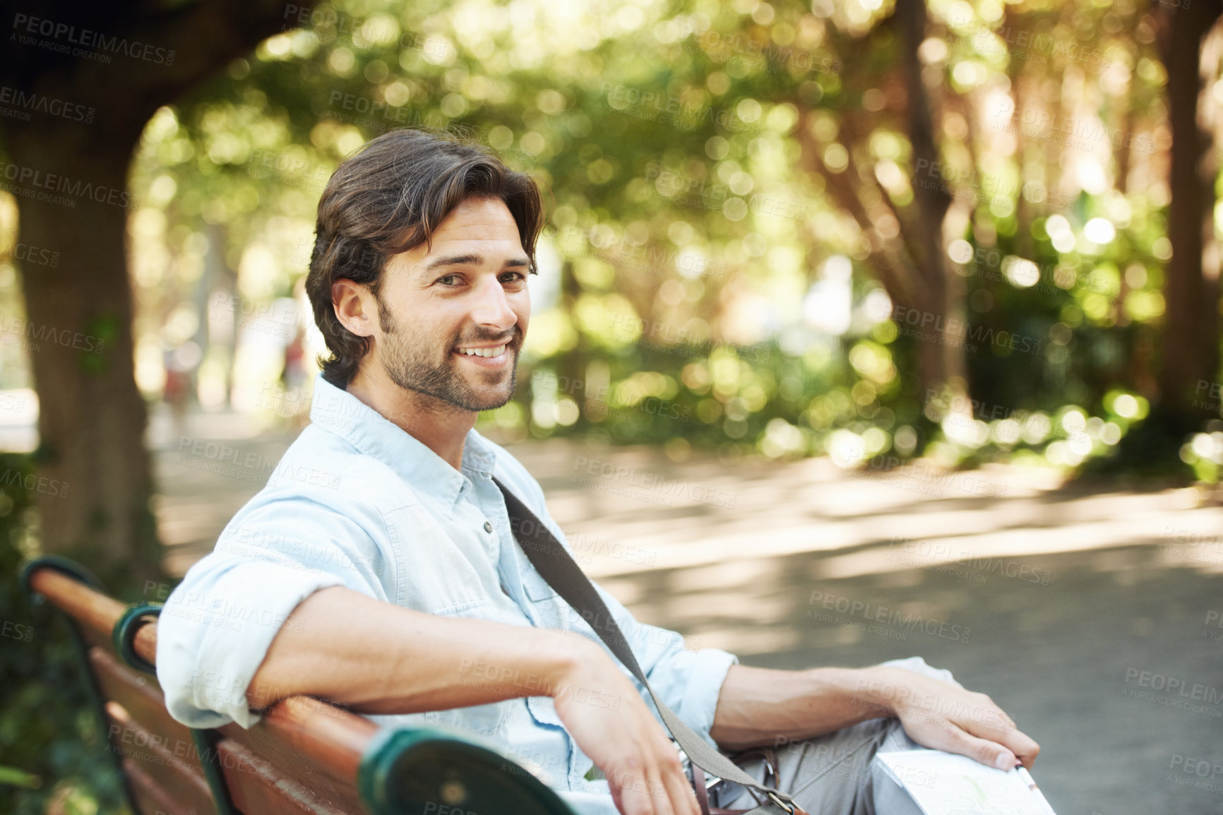 Buy stock photo Relax, portrait or happy man in park on a bench in summer for fresh air, holiday vacation or break in garden. Confident, smile or calm person in nature resting or waiting in a natural environment