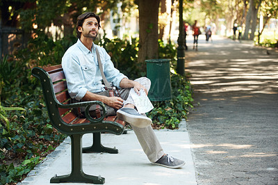 Buy stock photo Man, tourist and map on bench in park outdoor for travel, direction or location for explore in nature. Person, photography or paper on lap for adventure, journey or photographer with exploration