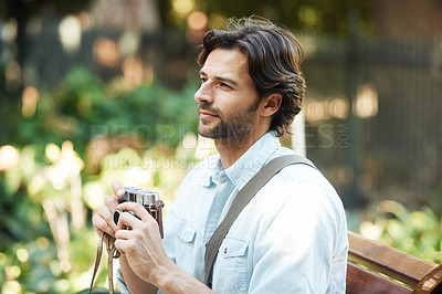 Buy stock photo Shot of a handsome young tourist checking out the sights