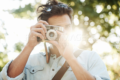Buy stock photo Camera, photography or man shooting in park on holiday vacation trip for creativity or tourism memory. Photographer, travel or male tourist with pictures for sightseeing or trees in nature in summer