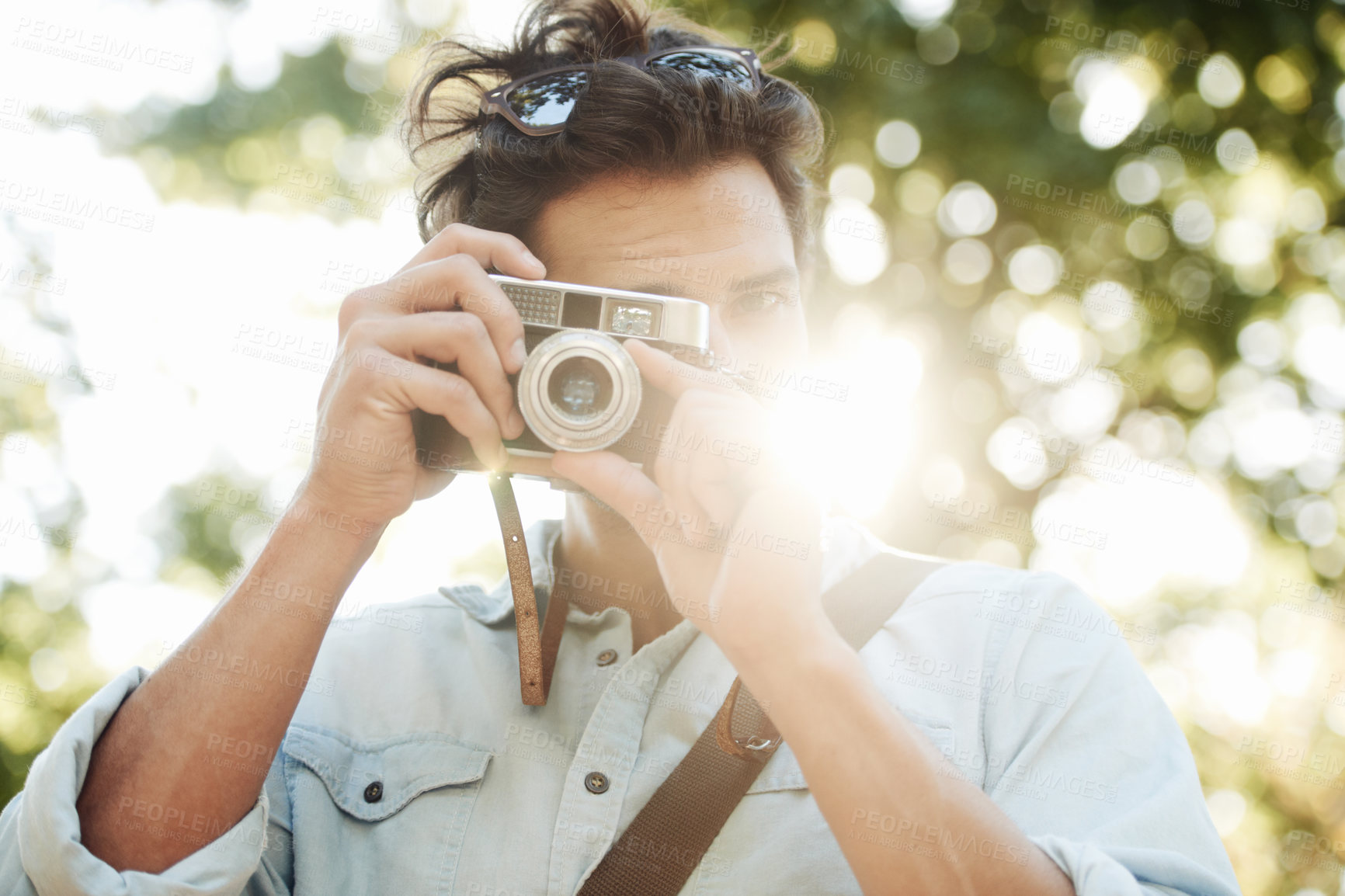 Buy stock photo Camera, photography or man shooting in park on holiday vacation trip for creativity or tourism memory. Photographer, travel or male tourist with pictures for sightseeing or trees in nature in summer
