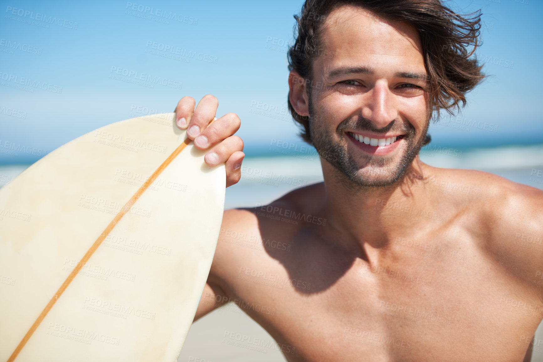 Buy stock photo Portrait, surfboard and a man in the sea at the beach for surfing while on summer holiday or vacation. Face, smile and sports with a happy young male surfer shirtless outdoor by the ocean for a surf
