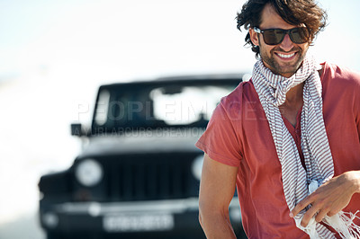 Buy stock photo Sunglasses, portrait and happy man in desert for road trip with freedom, travel and adventure for summer vacation. Transport, holiday journey and driver at van with nature, sunshine and countryside.