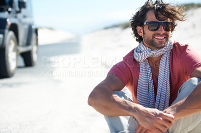 Buy stock photo Sunglasses, smile and man in desert for road trip with freedom, car travel and adventure for summer vacation. Transport, holiday journey and happy person at van with nature, sunshine and countryside.