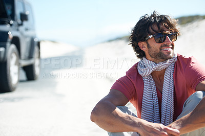 Buy stock photo Smile, happy man sitting in desert and road trip with freedom, car travel and adventure for summer vacation. Transport, holiday journey and smile, person with van in road nature, sunshine and relax.