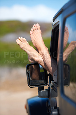 Buy stock photo Car window, feet and person on outdoor journey, easy adventure or motor transport on travel vacation, holiday or road trip. Automobile, relax legs and foot of driver driving in suv, van or vehicle