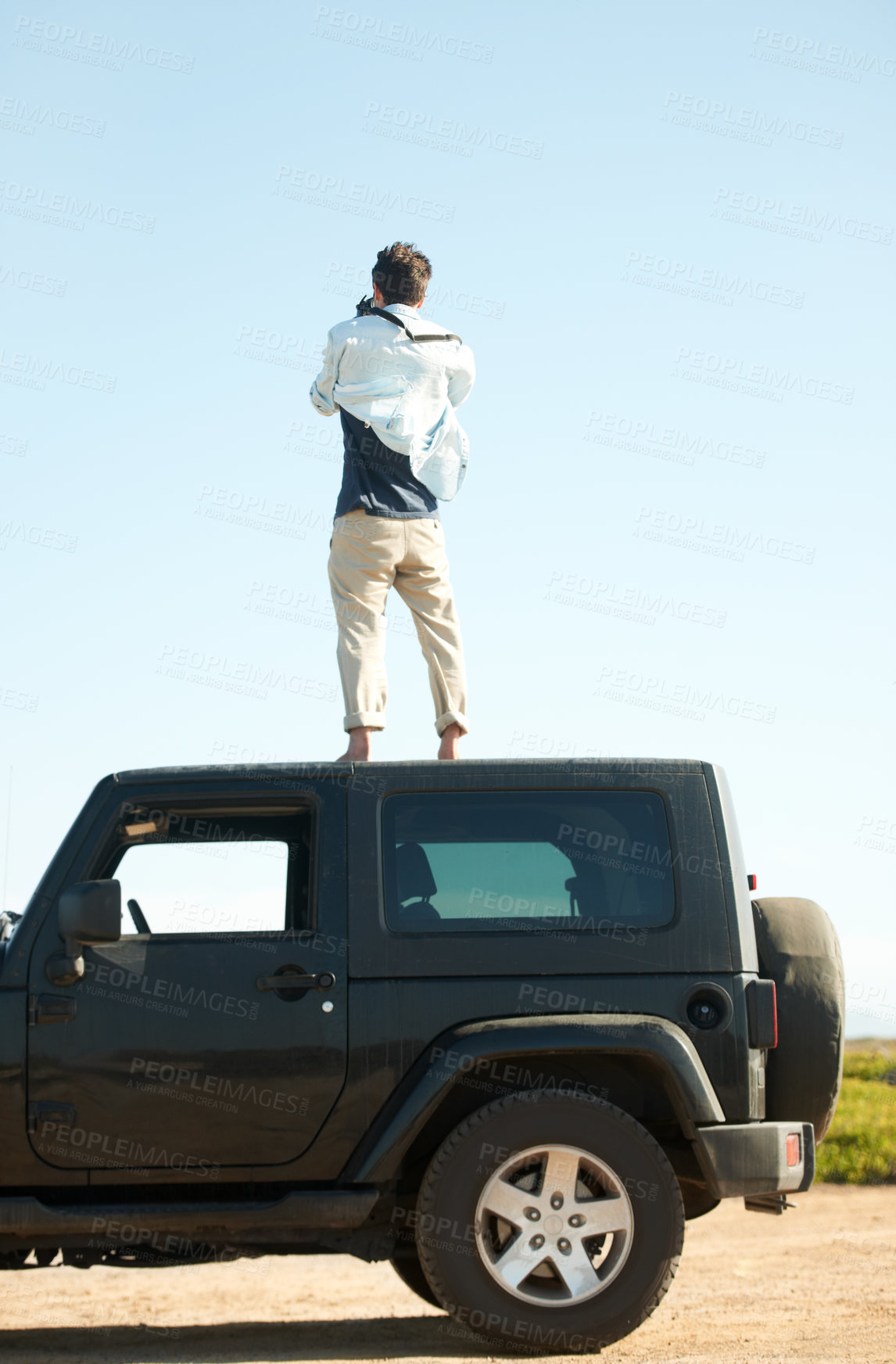 Buy stock photo Man, photographer and camera on roof of car, summer road trip or vacation outdoor on mockup space. Back view, person on suv rooftop and photography of driver on transport, nature adventure or travel