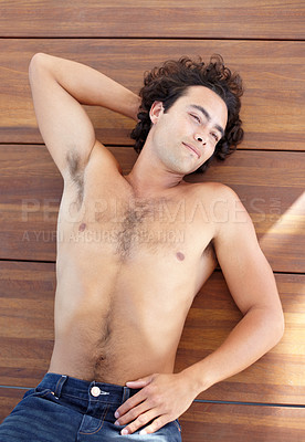 Buy stock photo Relax, thinking and a topless man lying on a wooden deck from above outdoor during a summer day. Idea, wellness and lifestyle with a handsome young male person relaxing shirtless on a wood floor