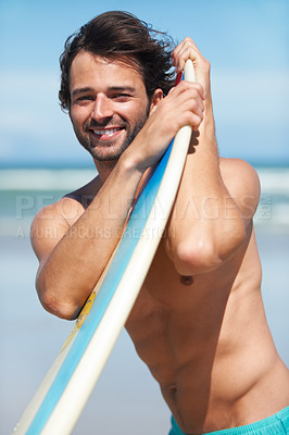 Buy stock photo Portrait, surf and a man in the ocean at the beach with his surfboard while on summer vacation or holiday. Face, smile and body with a happy young male surfer shirtless outdoor by the sea for surfing