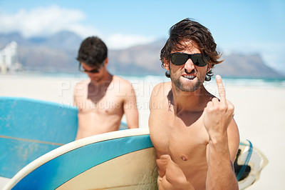 Buy stock photo Beach, middle finger and man surfing friends outdoor together for summer vacation or holiday trip overseas. Surf, sea or rude with a young male surfer in sunglasses and friend bonding at the coast