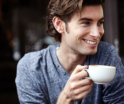 Buy stock photo A young man, happy and smiling with his coffee