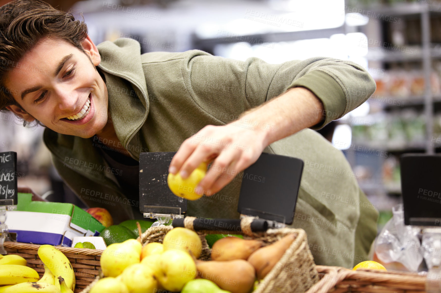 Buy stock photo Man, smile and fruit in grocery store for health diet, nutrition or shopping sale product. Male person, happy customer and apple choice in supermarket for organic vegan, quality price or fibre food