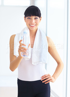 Buy stock photo Portrait, fitness and woman with a water bottle, health and exercise with hydration, towel and sports. Person, happy girl and athlete with liquid, aqua and workout with training, thirsty and wellness