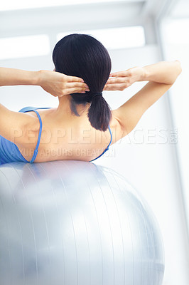 Buy stock photo Woman, exercise ball or back for pilates, wellness or workout on muscle, posture and healthy body. Person, arm or stretching for yoga, training or fitness with sportswear and technique in studio