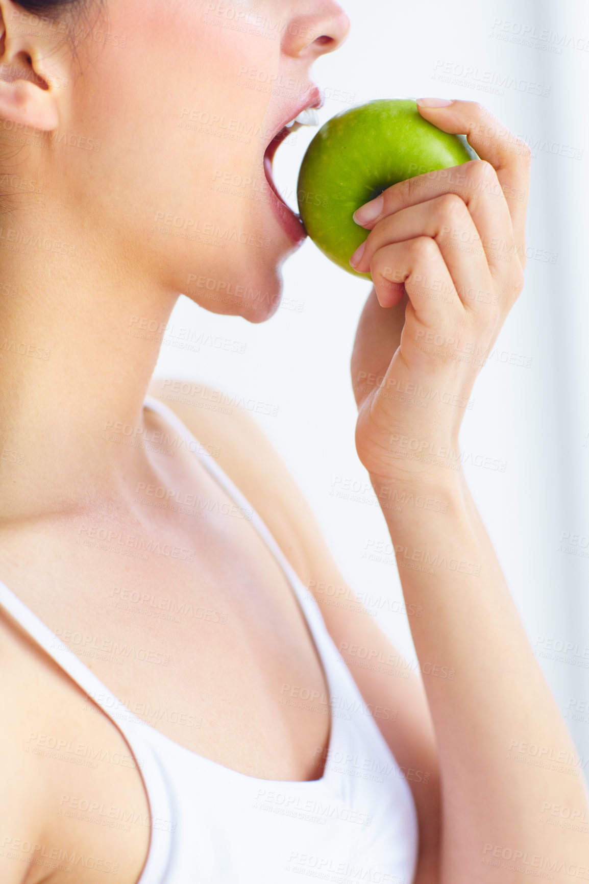 Buy stock photo Closeup, eating and woman with health, apple or wellness  with detox on a white studio background. Person, girl or model with fruit, nutrition or hungry with diet plan, food or natural with digestion