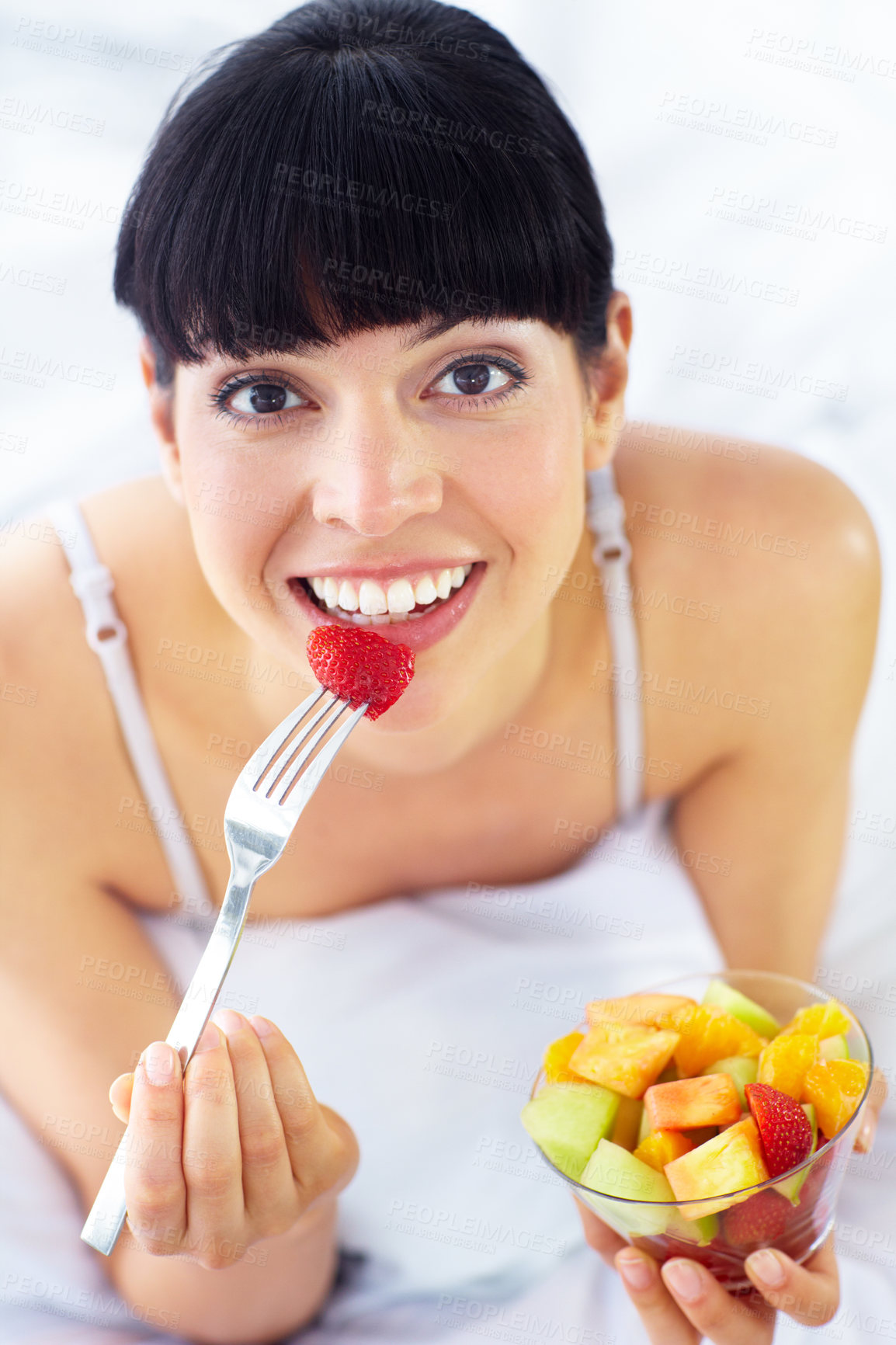 Buy stock photo Fruit salad, eating or portrait of happy woman with a morning breakfast or lunch diet in home. Smile, gut health or healthy vegan girl with fruits, snack or food bowl meal to lose weight or wellness 
