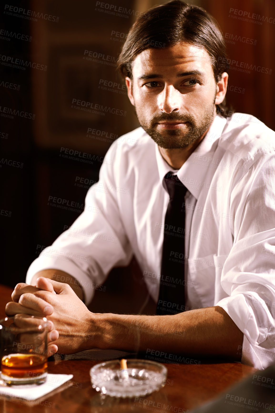 Buy stock photo Relax, thinking and a man at a bar for a drink after work, smoking and with alcohol. Smoke, idea and a young corporate businessman at a restaurant for a glass of whiskey and enjoying night at a club