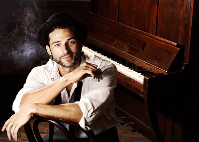 Buy stock photo Portrait, artist and man with a piano, smoking and creative with talent, performance and gig. Face, musician and club with a cigarette, jazz and ambient with tobacco, smile and confident player