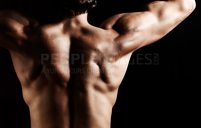 Buy stock photo Studio shot of a muscular shirtless man isolated on black