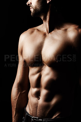 Buy stock photo Closeup, muscular and man with fitness, stomach and sexy against a dark studio background. Zoom, male person or confident model with wellness, healthy lifestyle or bodybuilder with muscle and abdomen