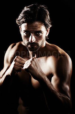 Buy stock photo Portrait, body of man and boxer fight in studio isolated on a black background. Face, boxing and muscle of topless athlete with fist ready for exercise, training or workout, sport and combat fitness