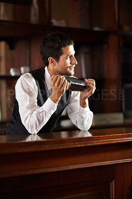 Buy stock photo Shake, mixer and bartender with a cocktail, drink or chat with customer in dark club at night. Mixing, alcohol and face of barman with vodka or liquor in metal container for a strong beverage in bar