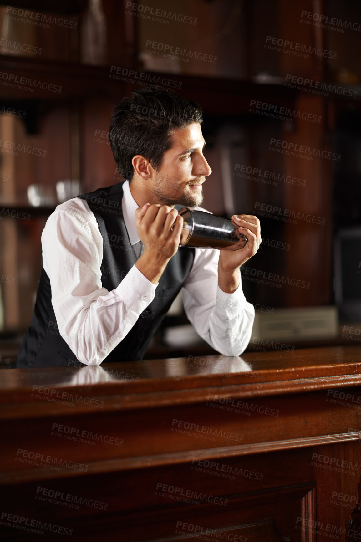 Buy stock photo Shake, mixer and bartender with a cocktail, drink or chat with customer in dark club at night. Mixing, alcohol and face of barman with vodka or liquor in metal container for a strong beverage in bar