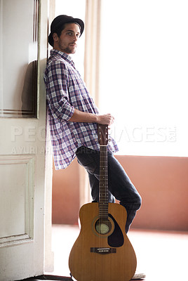 Buy stock photo Musician, portrait and man with a guitar, instrument and singer in a music studio. Creative, artist and guitarist standing in home and thinking of performance, equipment or listening to rock audio