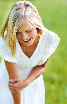 Buy stock photo Happy woman, laughing and nature for summer break, holiday or weekend at park in countryside. Female person or blonde smile on grass field in happiness, playing or satisfaction for fun outdoor day