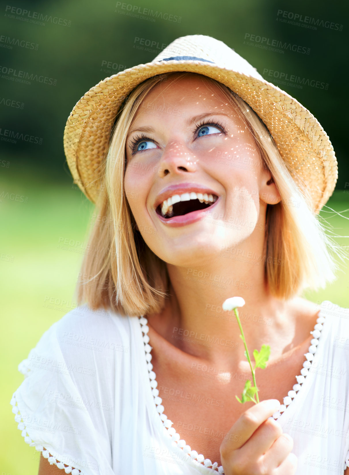 Buy stock photo Happy woman, hat and thinking in nature with flower for sunshine, freedom or outdoor vacation. Young female person or blonde smile in joy or happiness for sunny day or summer break at park or garden