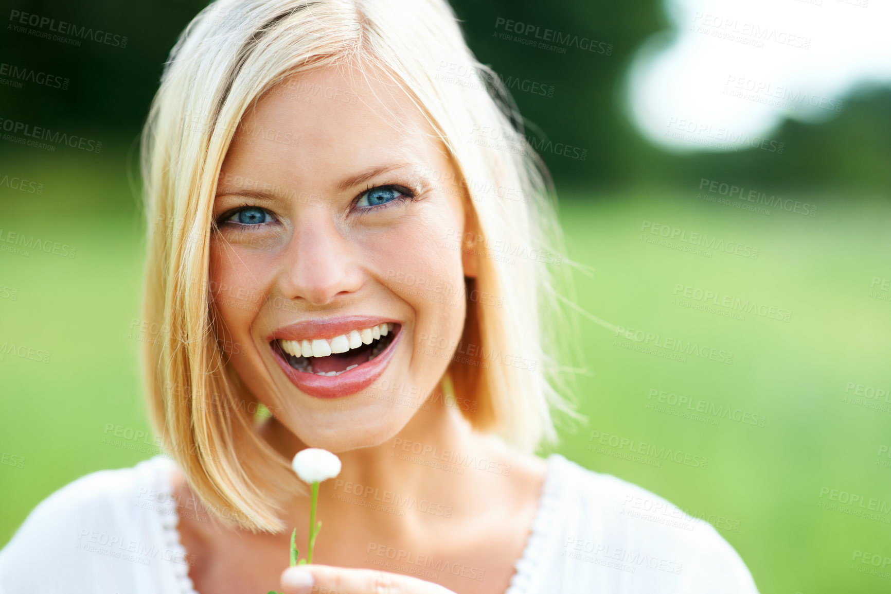 Buy stock photo Happy woman, portrait and face with flower, plant or dandelion in nature for outdoor environment. Female person or blonde smile with petal in happiness, eco friendly holiday or countryside vacation