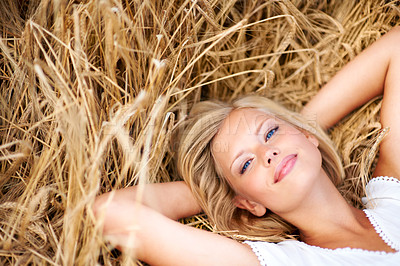 Buy stock photo Relax, portrait and woman lying on wheat field outdoor for adventure, journey or travel experience. Freedom, face and happy female person with resting in grass with stress free, peace and me time