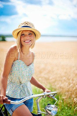 Buy stock photo Travel, portrait and happy woman with a bicycle in countryside for adventure, fitness or outdoor fun. Face, smile and female cycling in nature with freedom, journey or explore on holiday in Canada
