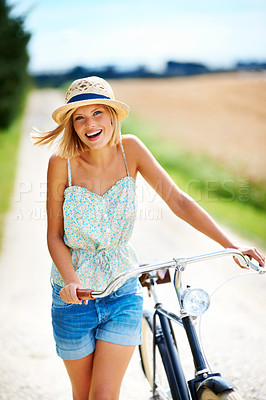 Buy stock photo Travel, portrait and happy woman with a bicycle in the countryside for fitness while on vacation. Freedom, face and female person cycling in nature for holiday, trip or peaceful bike ride in France